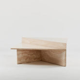 Triangular travertine coffee table